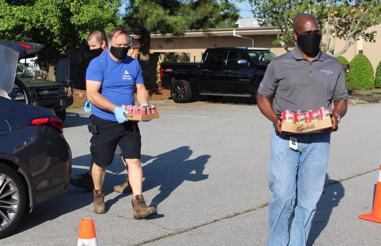 Atlanta Gas Light employees practiced social distancing while unloading donations