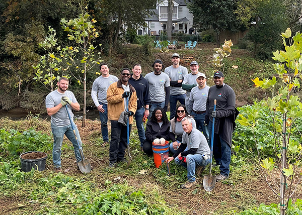 Atlanta Gas Light Piedmont Enhancement Project team replaces Peachtree Hills kudzu with sycamores, tulip poplars and bald cypress trees