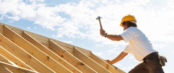 Person constructing roof top