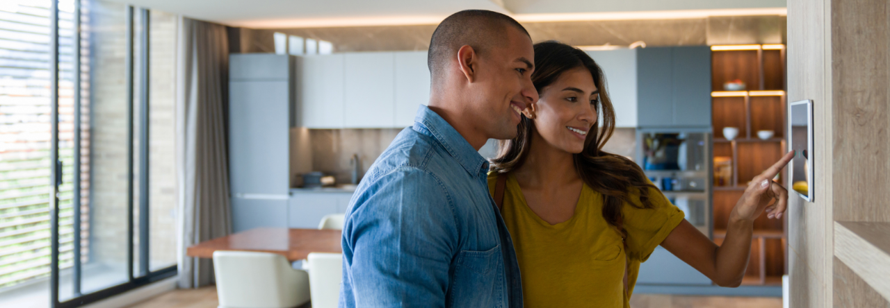 Couple operating thermostat