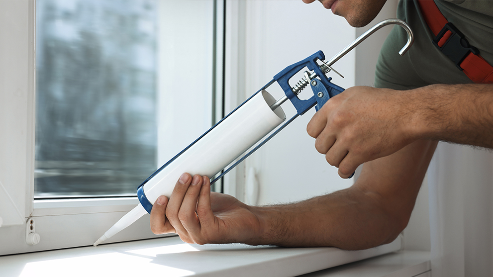 energy savings - caulking a window